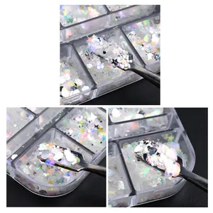 Detailed view of iridescent laser nail glitter sequins in assorted shapes with a small tool