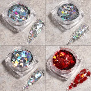Detail of laser holographic nail sequins in butterfly star and heart shapes in clear boxes