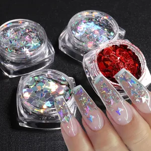 Macro shot of 4-piece nail art sequin set with laser stars, butterflies, and hearts