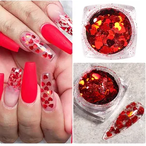 Detail of red heart nail art sequins and glitter flakes in a clear jar for DIY manicures