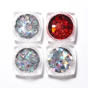 Macro detail of 4-pack nail art sequins with butterfly, heart and star shapes in clear boxes