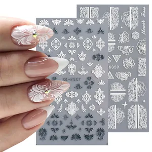 Detail showing 5D embossed white rose nail art stickers with vintage floral patterns