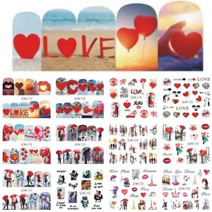 Selection of nail art water decals featuring romantic red hearts and Paris motifs