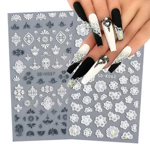 Macro view of 5D white lace relief flower nail stickers with textured 5D-K057 and 5D-K062 patterns