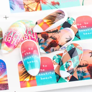 Detailed view of summer beach party nail stickers featuring sunset palm trees and flamingos