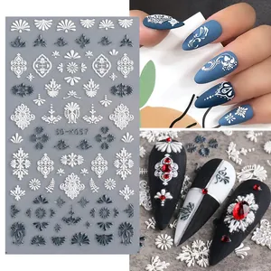 Macro detail of 5D embossed white lace flower nail art stickers on matte blue nails