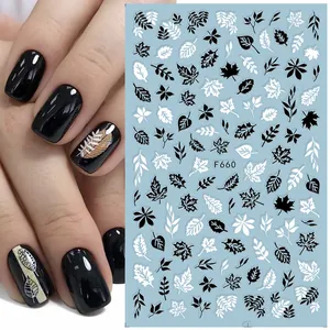 Detail of 3D leaf pattern nail stickers in black and white with model code F660