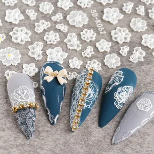 Detailed 5D embossed nail stickers featuring white lace flowers and 3D floral textures