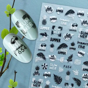 Detail of 3D leaf and pineapple nail stickers on light green nails with F654 sheet