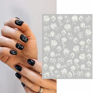 Stickers à ongles lumineux aux motifs de visages abstraits et fleurs blanc mat