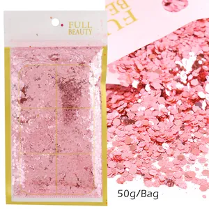 Vista macro di paillettes esagonali rosa da 50g per unghie in confezione originale