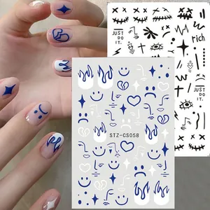 Blue flame and smiley face nail art stickers with heart patterns and artistic lines