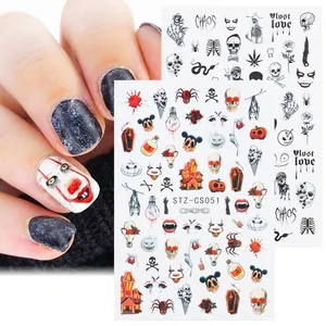 Detail of Halloween nail stickers featuring dark skulls, pumpkins, and clown motifs