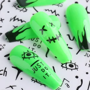 Detail of neon green trapezoid nails with black flame and hand-drawn graffiti art