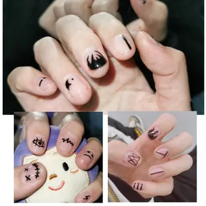 Detailed view of Halloween nail stickers with black flame and abstract art patterns