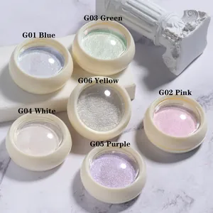 Macro view of six-color solid aurora nail powder set on white marble background