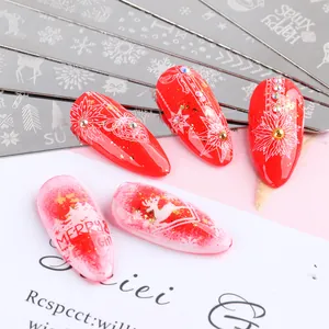 Detail of Christmas nail stamping plates with snowflake patterns and festive nail art