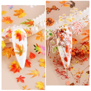 Detail of autumn maple leaf nail transfer foils with Happy Thanksgiving calligraphy designs