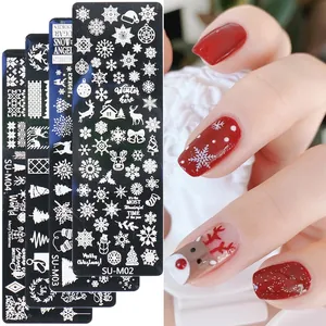 Christmas nail art stamping plates set with snowflakes and reindeer patterns on stainless steel