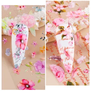 Detail of floral nail transfer stickers with pink flowers and lovely flowers text