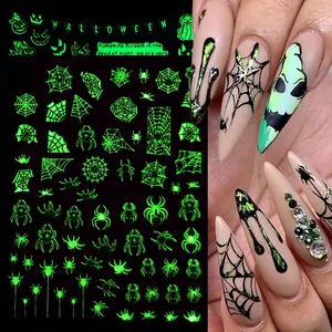 Adesivi per unghie Halloween luminosi con motivi di ragnatele e zucche fluorescenti