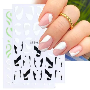 Détail de stickers 3D French manucure avec vagues et motifs géométriques sur ongles