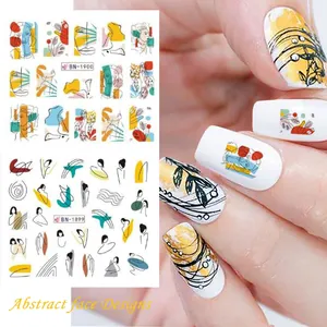 Detail of abstract face nail art stickers with geometric lines and Picasso style patterns