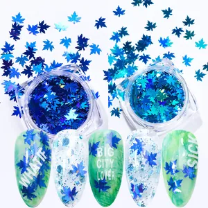 Paillettes per unghie a foglia d'acero con sfumatura blu in contenitori trasparenti e tips
