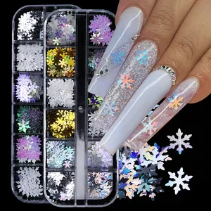 Holographic snowflake nail art sequins in a 12-grid storage box for Christmas winter manicures