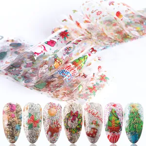 Detalle de láminas de transferencia para uñas navideñas con diseños de Papá Noel