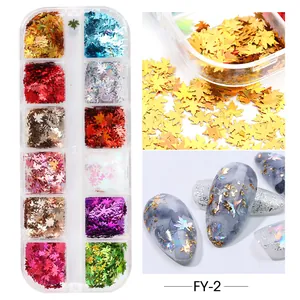 Vista macro di paillettes per nail art a foglia d'acero in 12 colori in scatola
