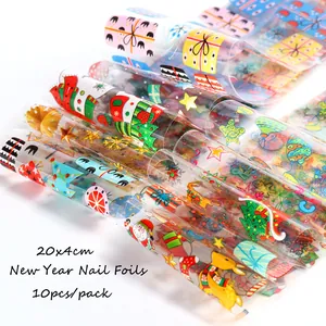 Detalle de 10 hojas de pegatinas navideñas para uñas 20x4cm con Papá Noel y copos de nieve