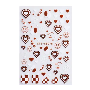 Red and white checkerboard nail stickers with heart, smiley face and line art designs