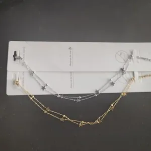 Double-layered stainless steel star anklet in gold and silver finish with tiny beads