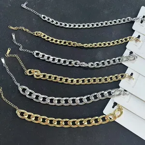 Meerdere gouden en zilveren roestvrijstalen Cubaanse schakelarmbanden met sluiting
