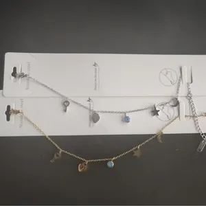 Set de tobilleras ajustables de acero inoxidable con dijes de estrella, luna y ojo de la suerte