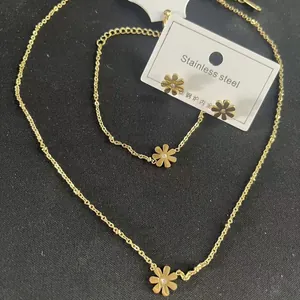 Gold plated stainless steel jewelry set featuring daisy necklace and earrings