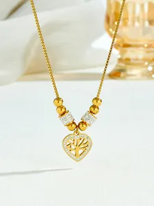 Close-up of golden heart-shaped life tree pendant necklace with shimmering zircon accents