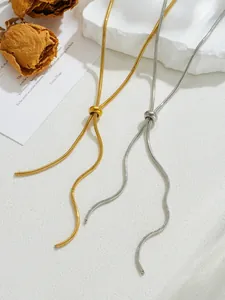Detail of adjustable 16K gold and silver snake bone chain with sliding pull buckle