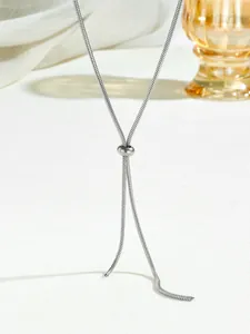 Detail of silver snake chain necklace with an adjustable spherical metal slide buckle