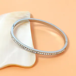 Polished silver titanium steel oval bangle with full sparkling rhinestone inlay for women