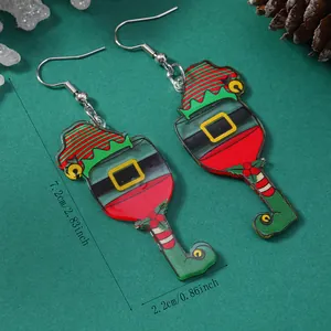 Detail view of acrylic Christmas wine glass earrings with size measurements in inches