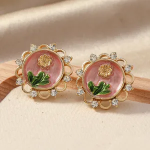 Detail of vintage oil painting style earrings with pink enamel flower and pearls