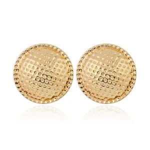 Minimalist hammered gold irregular geometric stud earrings with textured metallic finish