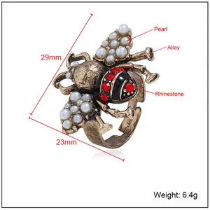 Detailed view of bee ring showing dimensions 29mm by 23mm with alloy and pearl materials
