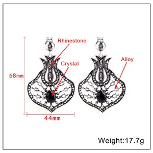 Detailed view of long fan-shaped tassel earrings showing dimensions of 68mm by 44mm