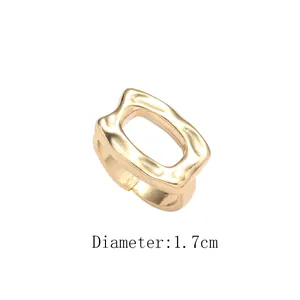 Detail of 1.7cm adjustable golden open ring featuring textured rectangular geometric surface