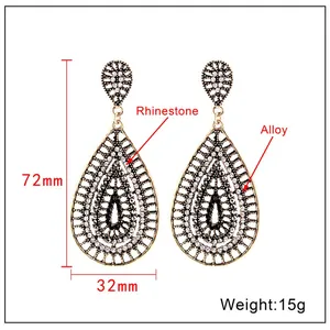 Detailed view showing the 72mm height and 32mm width of the rhinestone fan tassel earrings