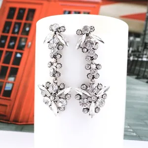 Elegant silver tassel zircon earrings with crystal leaf motifs for wedding and party wear