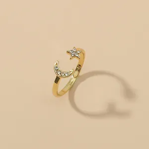 Adjustable gold star and moon crescent open ring with sparkling crystal inlay